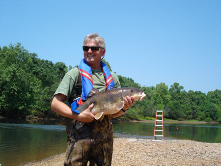 Forrest Sessions, South Carolina Department of Natural Resources (SCDNR), holds a 9 lb. robust redhorse captured on the Savanna River near Augusta, SC.
